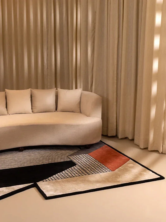 Freeform rug with irregular shape and black beige cream geometric pattern