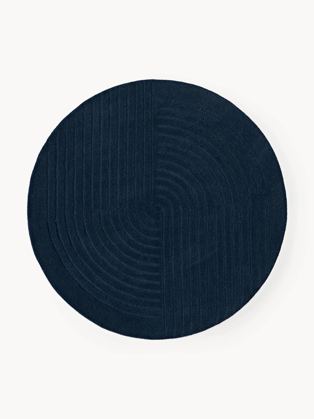 Navy circle rug in a round blue design with subtle concentric lines
