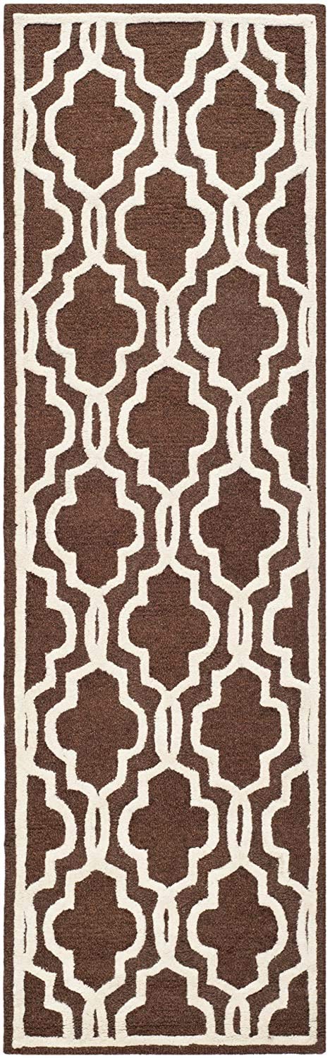Parpuse runner carpet with a brown base and cream geometric pattern