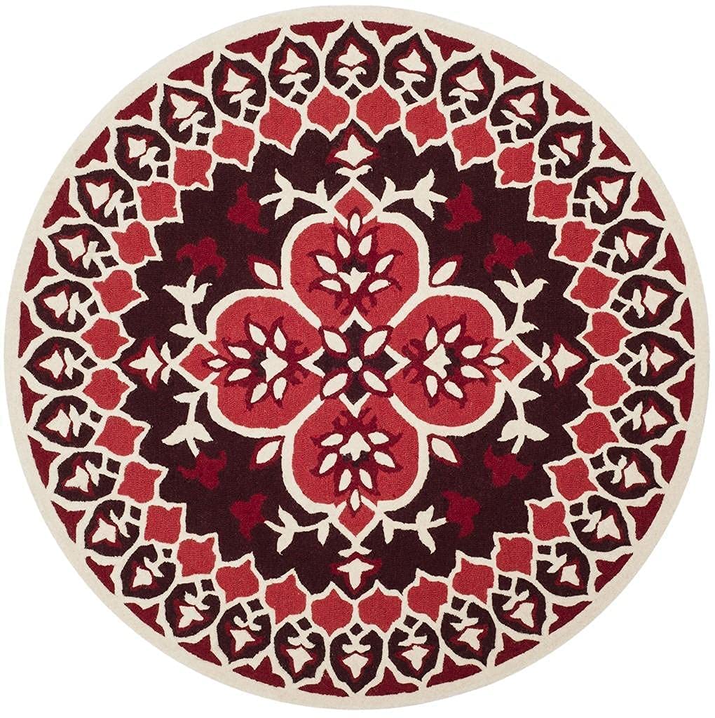 Red round carpet with circular medallion design and cream ornamental border